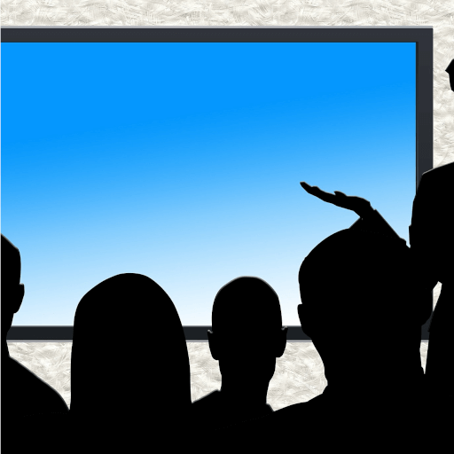 people looking at a monitor during a presentation